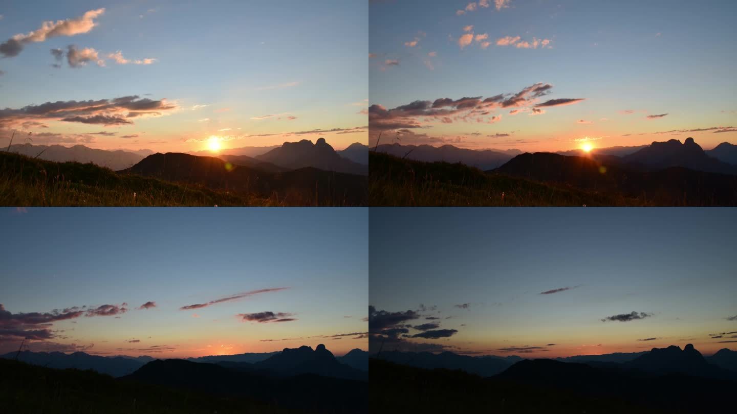 在艾森纳泽阿尔卑斯山脉的莱奥布纳山顶上的延时日落，在国家公园Gesäuse的rottenmantau