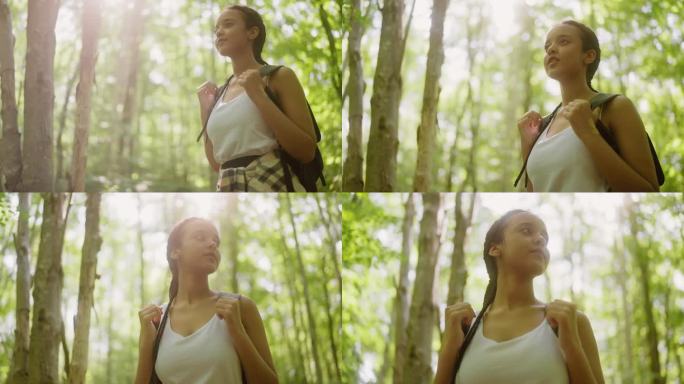年轻女子在美丽的北欧森林里四处张望