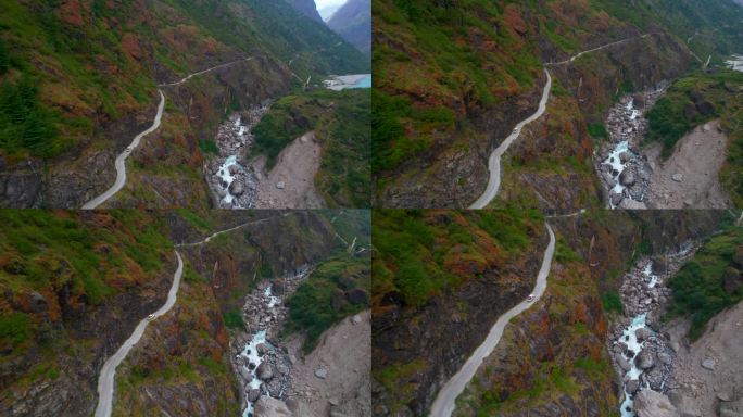鸟瞰图四驱车行驶在蜿蜒的山路。在喜马拉雅山山脉冒险公路旅行。安纳普尔纳环行。独特的管理理念。