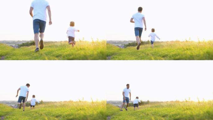 快乐的父亲和儿子在夕阳下的草地上奔跑。友好的家庭梦想生活在一起