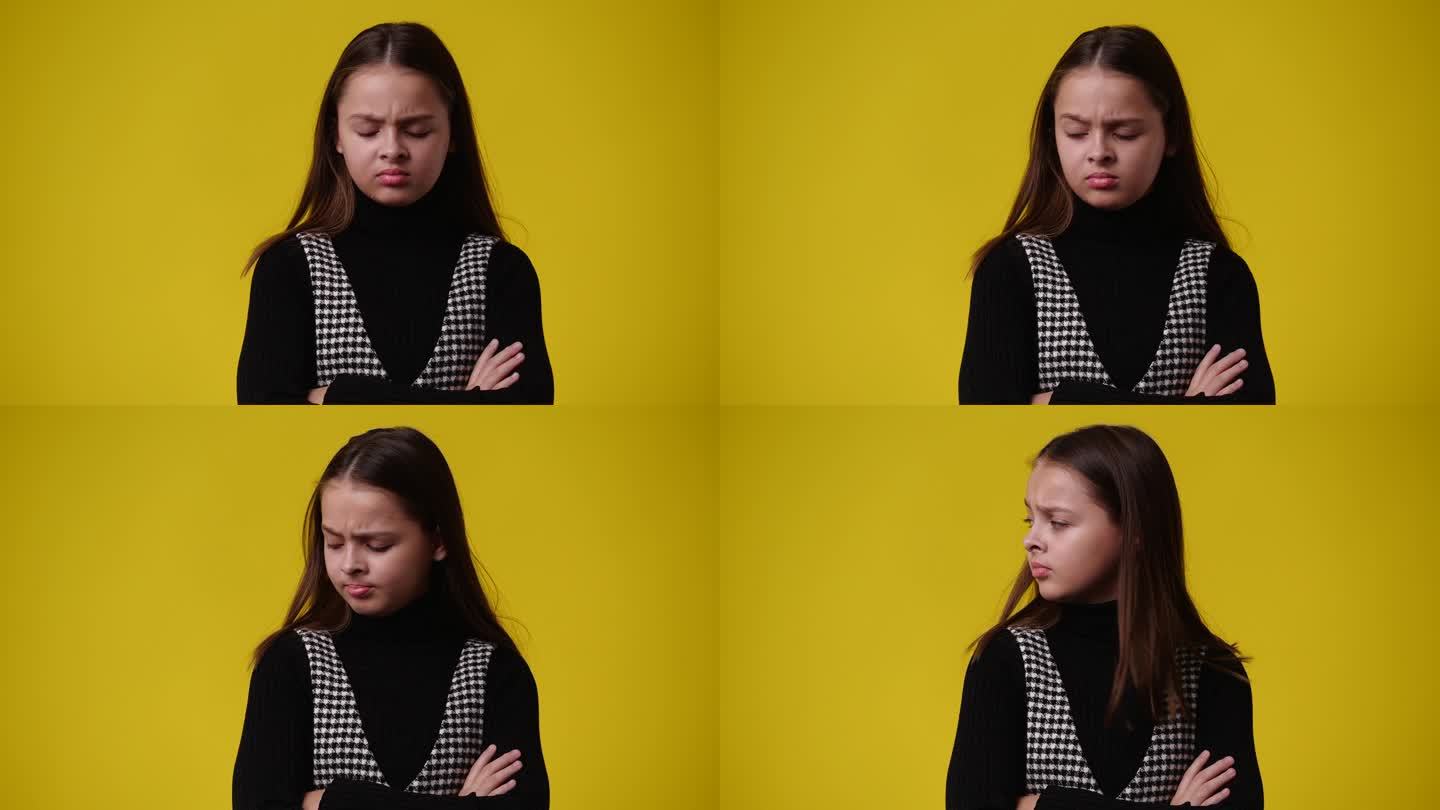 一个女孩的4k视频，黄色背景上有消极的面部表情。