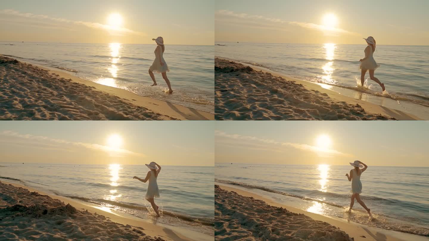 慢镜头，一个穿着漂亮裙子的快乐女人在金色日落的海滩上奔跑