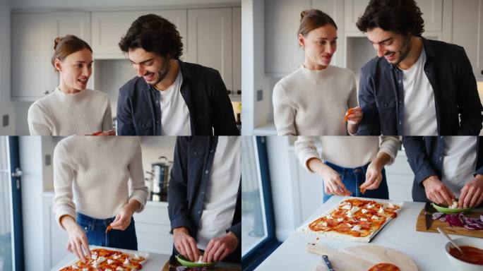 年轻夫妇在家里的厨房里一起做新鲜披萨的特写