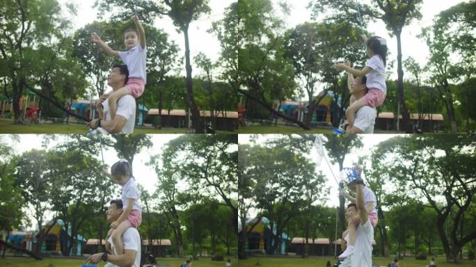 小女孩背着爸爸玩蝴蝶网