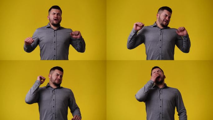 一段4k视频，一个男人在黄色背景上摆姿势拍摄视频。
