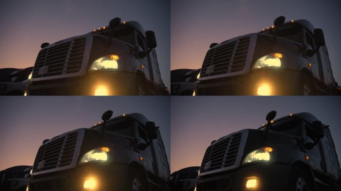 半挂车在其他卡车停着的地方停放过夜。宽移摄像机