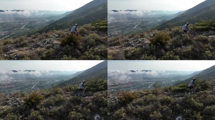 资深男性山地自行车手穿越崎岖的山脊