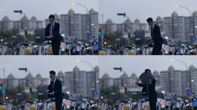 一名亚洲男性上班族正在用手机扫描一辆共享单车的二维码，准备租用和使用。