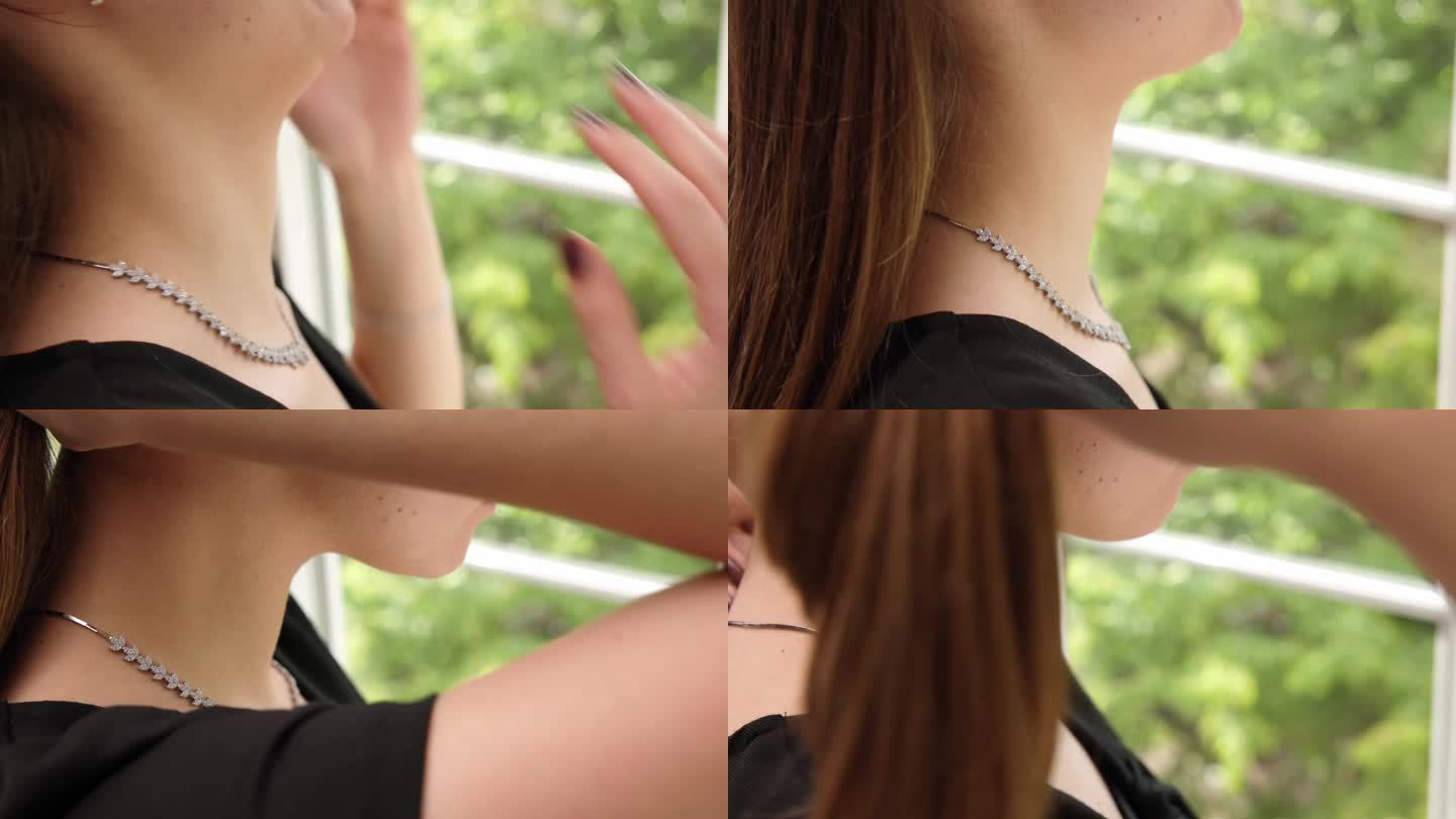 一个无法辨认的年轻女子正在调整脖子上的银项链