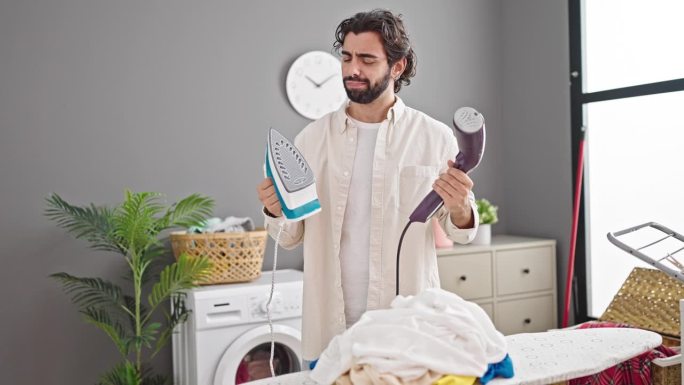 年轻的西班牙裔男子在洗衣房选择熨烫机
