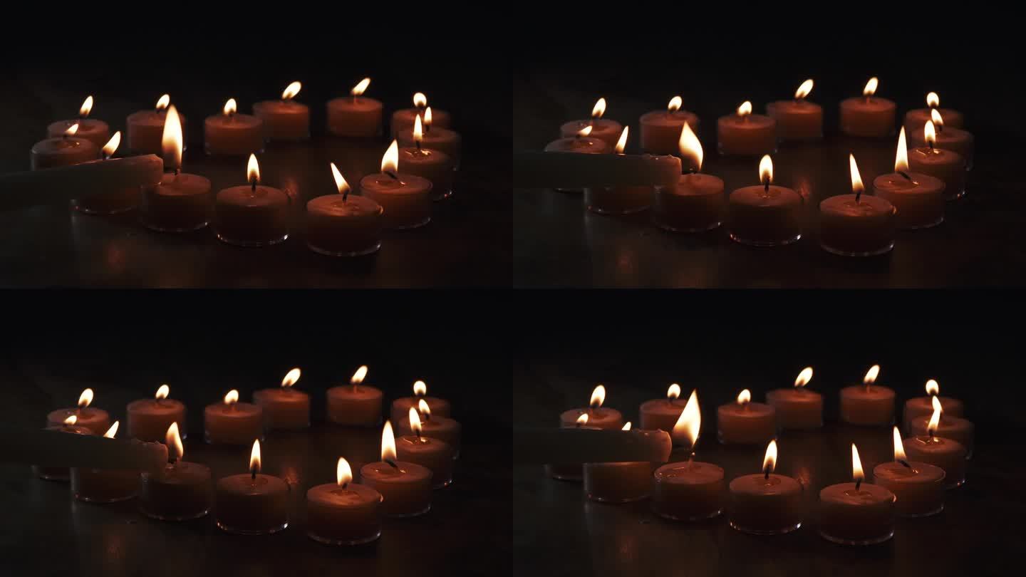 点灯的蜡烛呈心形，最后以慢动作点燃