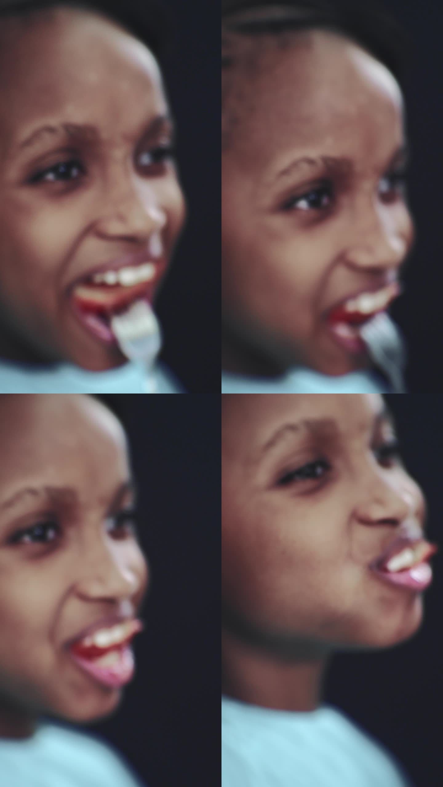 一个女孩正在吃一个红色的大西红柿