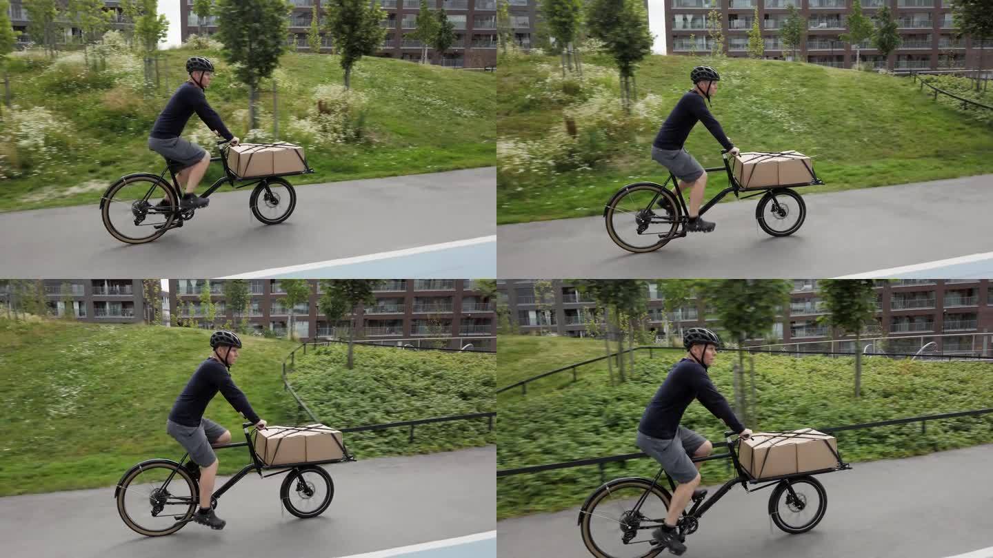 骑自行车的邮递员用他的货运自行车送包裹