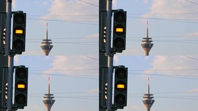 自行车和行人的交通信号灯从红灯变为绿灯，显示了从自行车的角度来看，城市街道从红色变为绿色