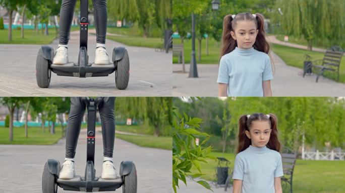 小女孩在公园的路上骑着摩托车