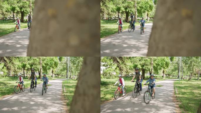 在一个阳光明媚的日子里，一家人在公园骑自行车