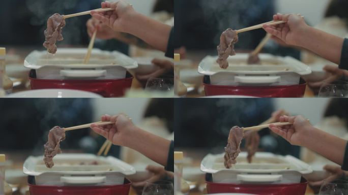 饥饿的人们用筷子夹着猪肉片，在公寓里度过漫长的周末。