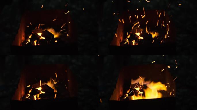 在蒙古生火。从火中冒出明亮的火花。在营地烧烤。夜晚美丽的火焰。晚上在火堆旁聚会