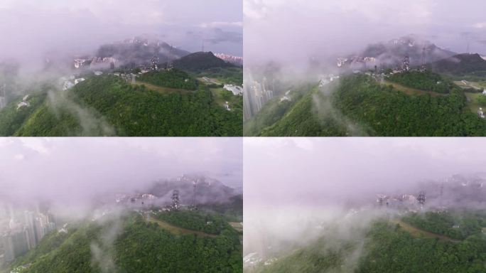 城市中雾和云的电信天线鸟瞰图，连接技术概念