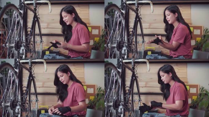 亚洲女性在家车库自己修理和保养自行车的断裂和链条，潮女小企业主在自行车车间工作。