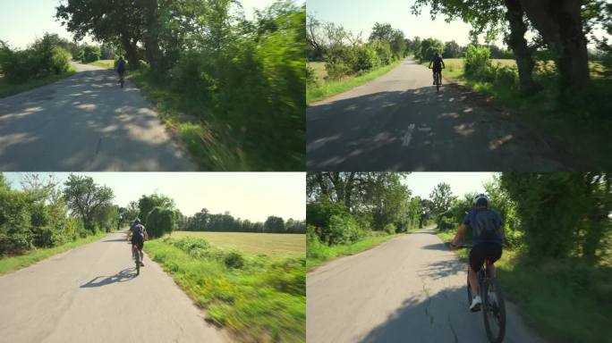 骑自行车的人在路上骑自行车。日落的锻炼。本空间