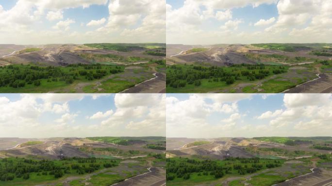 鸟瞰图时移露天煤矿采煤。露天采矿有大量的工作卡车和挖掘机。