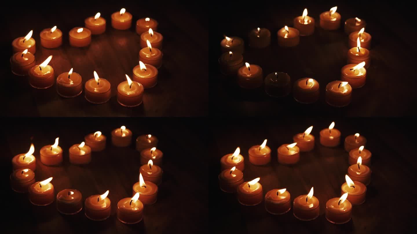 点灯的蜡烛呈慢动作的心形