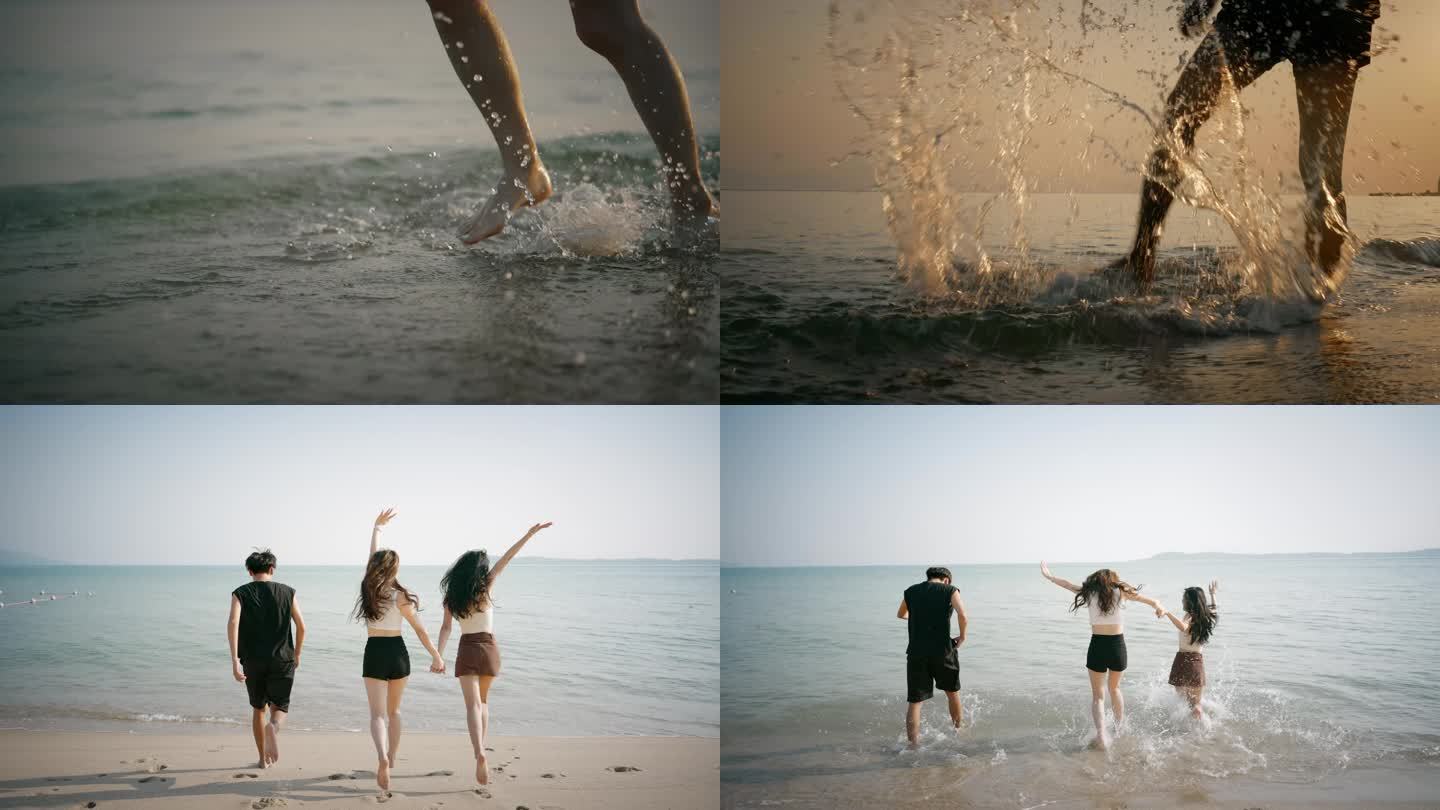 年轻男女海边玩耍跳舞玩水