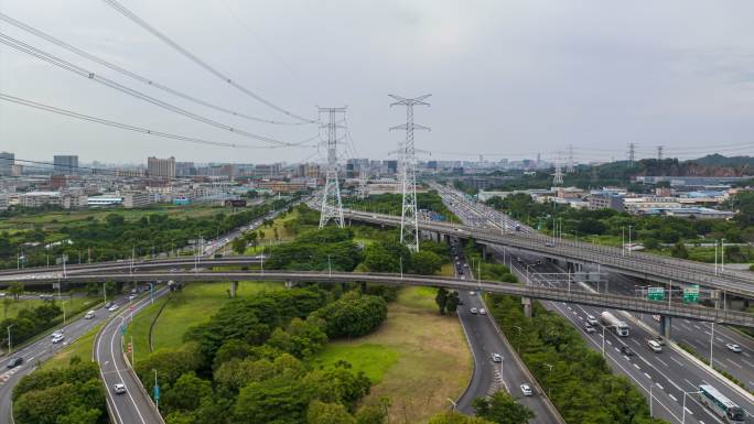 航拍城市电塔铁塔道路车流延时