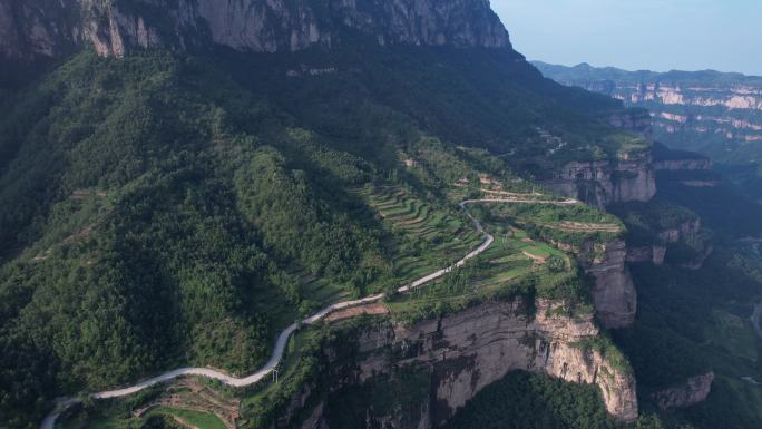 山顶公路航拍陡峭悬崖边的道路