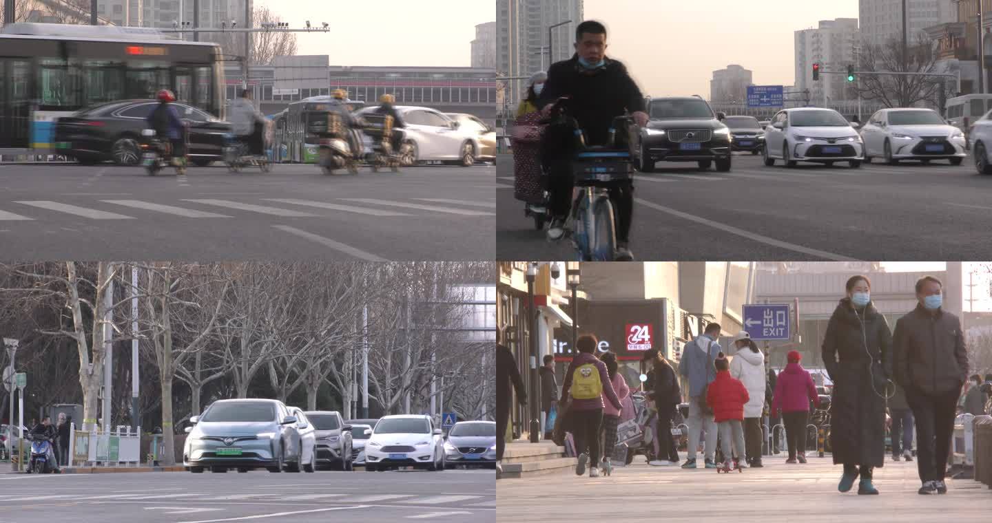 车流忙碌过马路人文夕阳城市生活骑行冬天