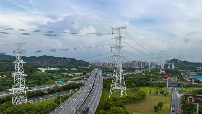 航拍城市电塔铁塔公路车流延时