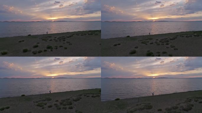 青海湖夕阳一个人在行走航拍