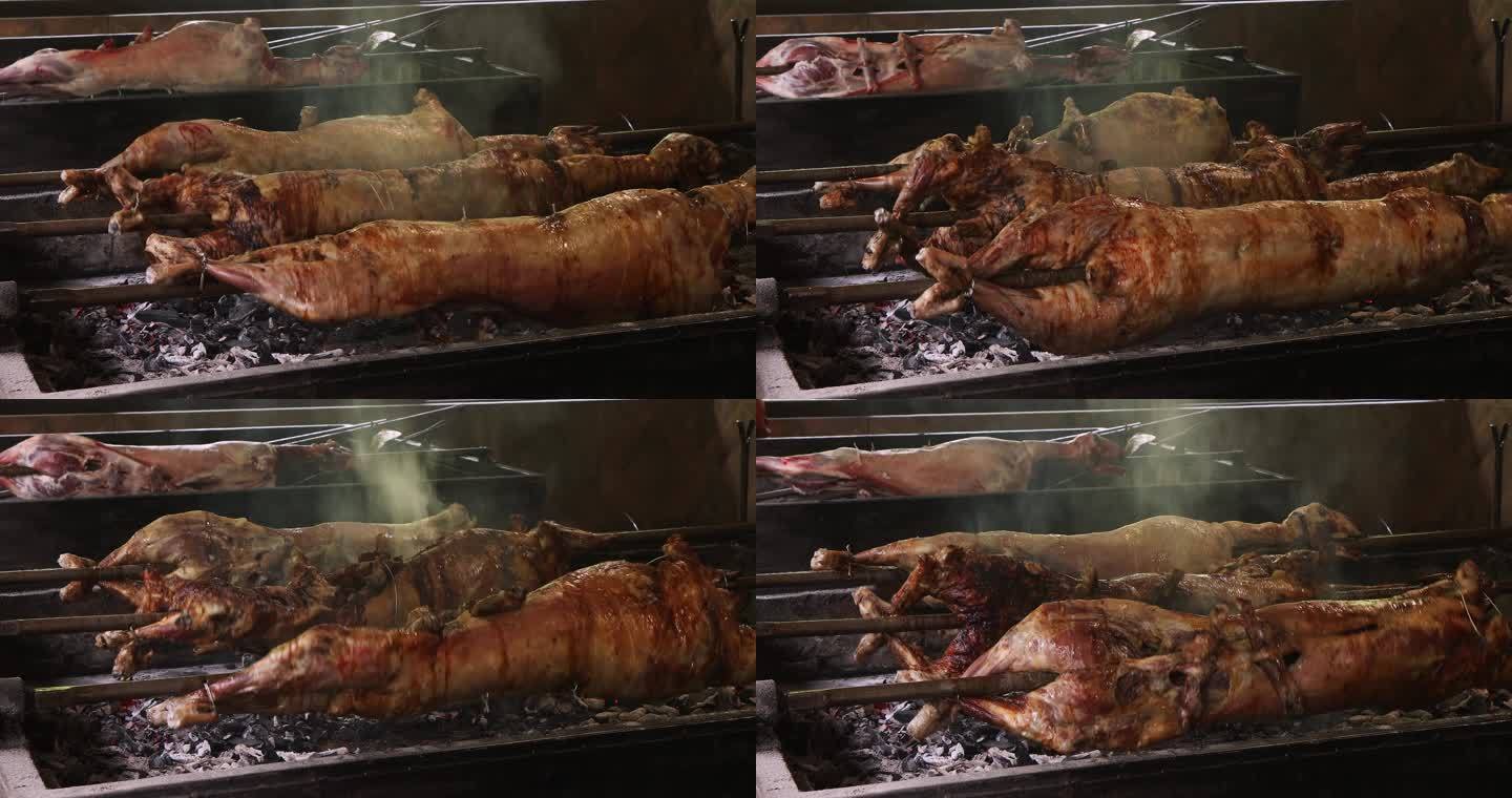 烤全羊，烤羊肉，炭火上正在旋转的烤羊肉