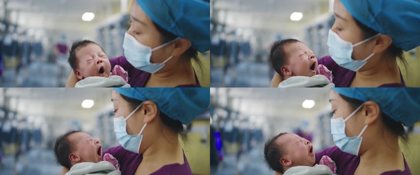 医院医生护士新生儿婴儿怀抱中哭啼温暖感人