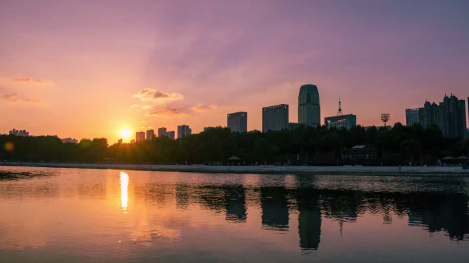 湖面城市滨湖城市背景丁达尔日落夜景延时