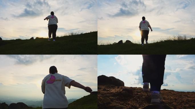 一个肥胖的女人在山顶奔跑运动减肥