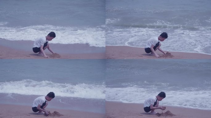 海边堆沙小男孩