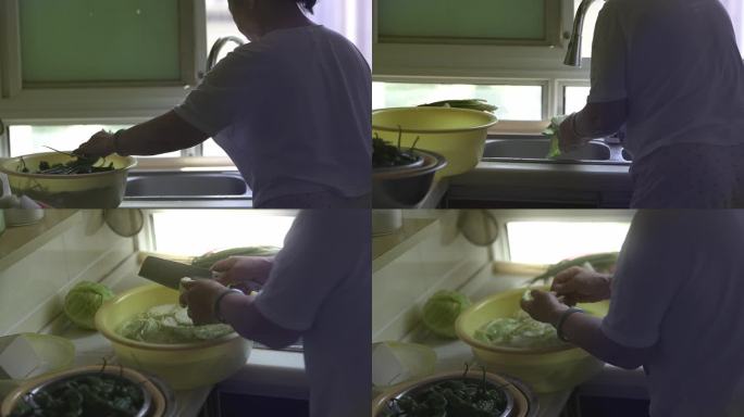 退休居家老人在洗菜切菜