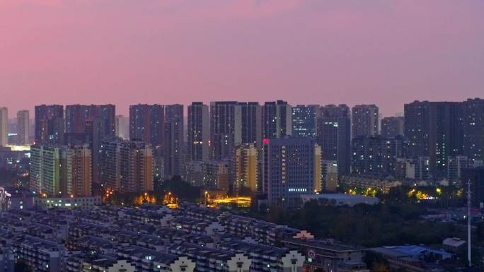 航拍城市车道车流行驶高楼夜景夕阳素材