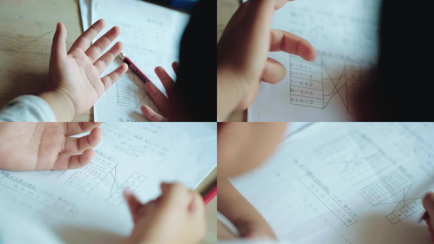 小朋友在家认真的做数学作业