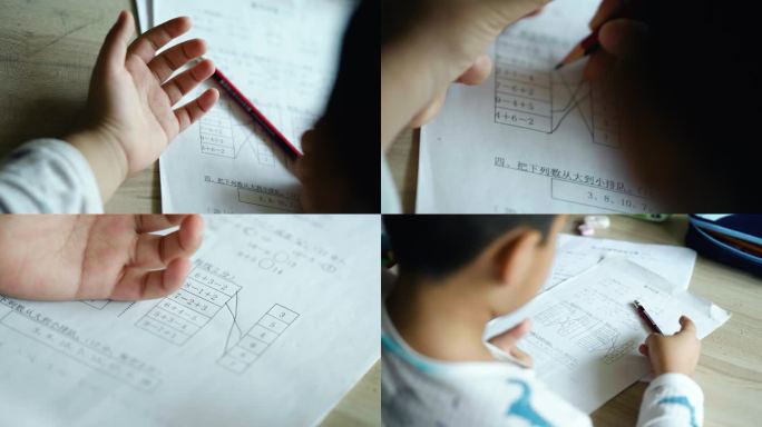 小朋友在家认真的做数学作业