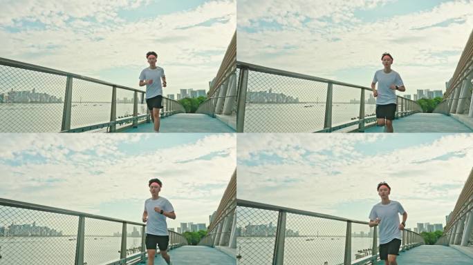 年轻人跑步 城市日出江边跑步