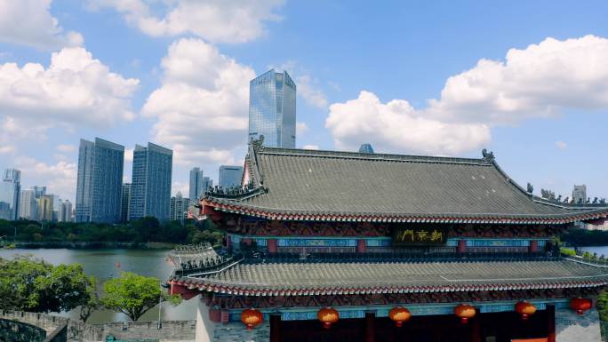 4k航拍惠州朝京门与现代建筑富力万丽酒店