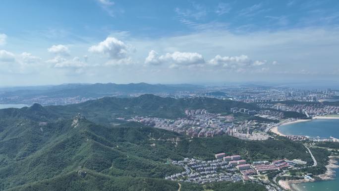 航拍蓝天白云之下的威海市环翠区孙家疃群山