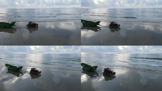 岸边沙滩渔船搁浅渔民赶海拖船航拍