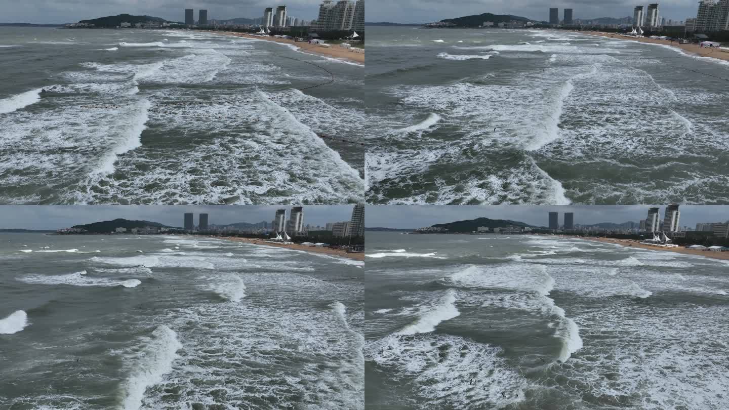 航拍威海国际海水浴场波涛汹涌的礁石海浪