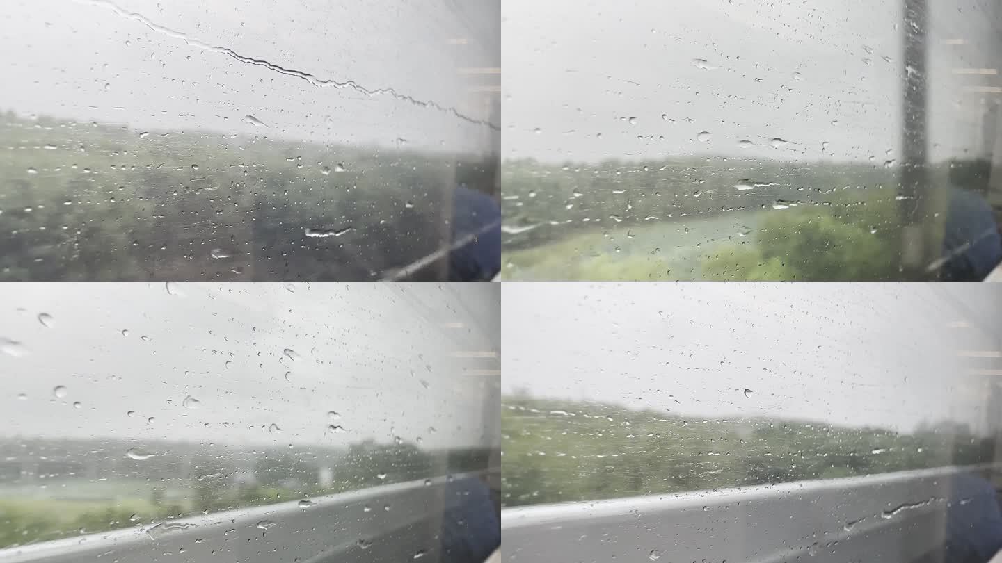 动车高铁车窗外的雨水水滴打在玻璃上划过