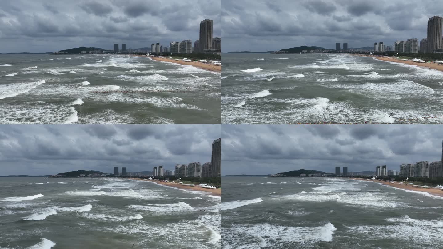 航拍威海国际海水浴场波涛汹涌的礁石海浪