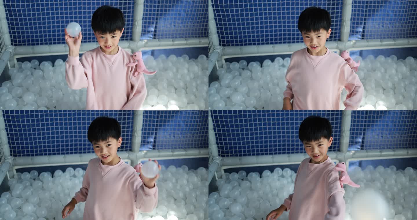 男孩在室内游乐场玩塑料球4k升格慢镜